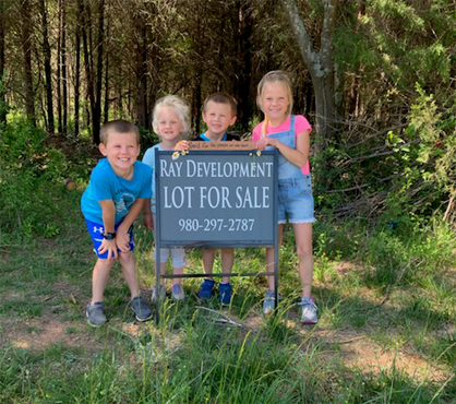 Ray Development lot for sale sign